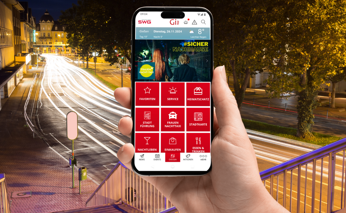 Ein Smartphone mit dem Screen der Giessen App. Es wird vom Elefantenklo auf die Westanlage geschaut.